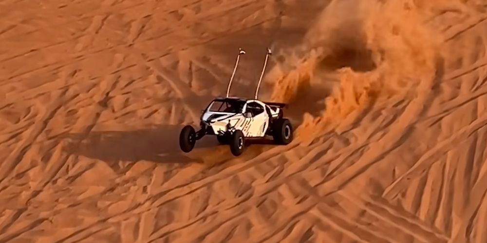 Sandy buggy pops a wheelies on Dubai dune