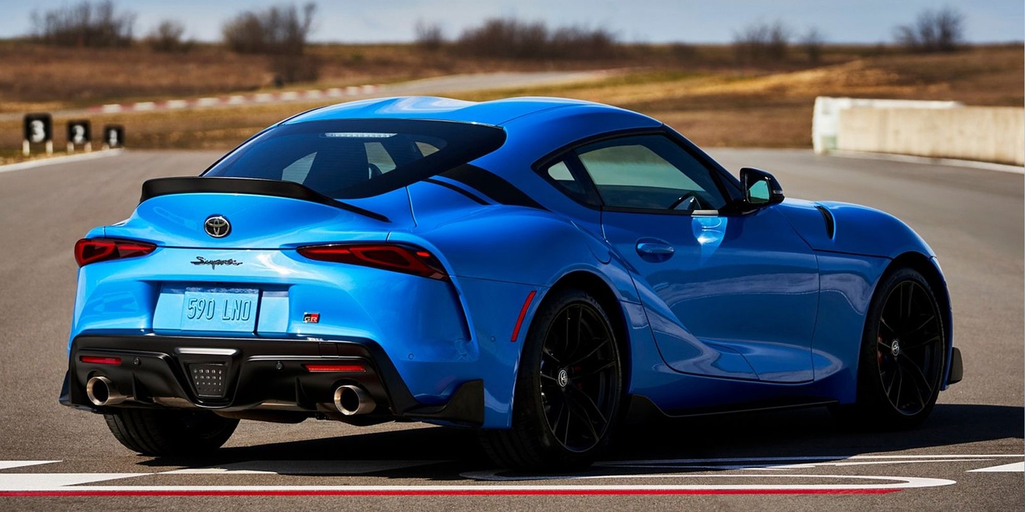 Rear 3/4 view of a blue GR Supra