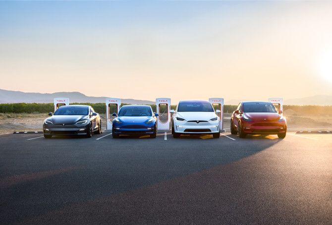 Tesla EV lineup at chargers, front view