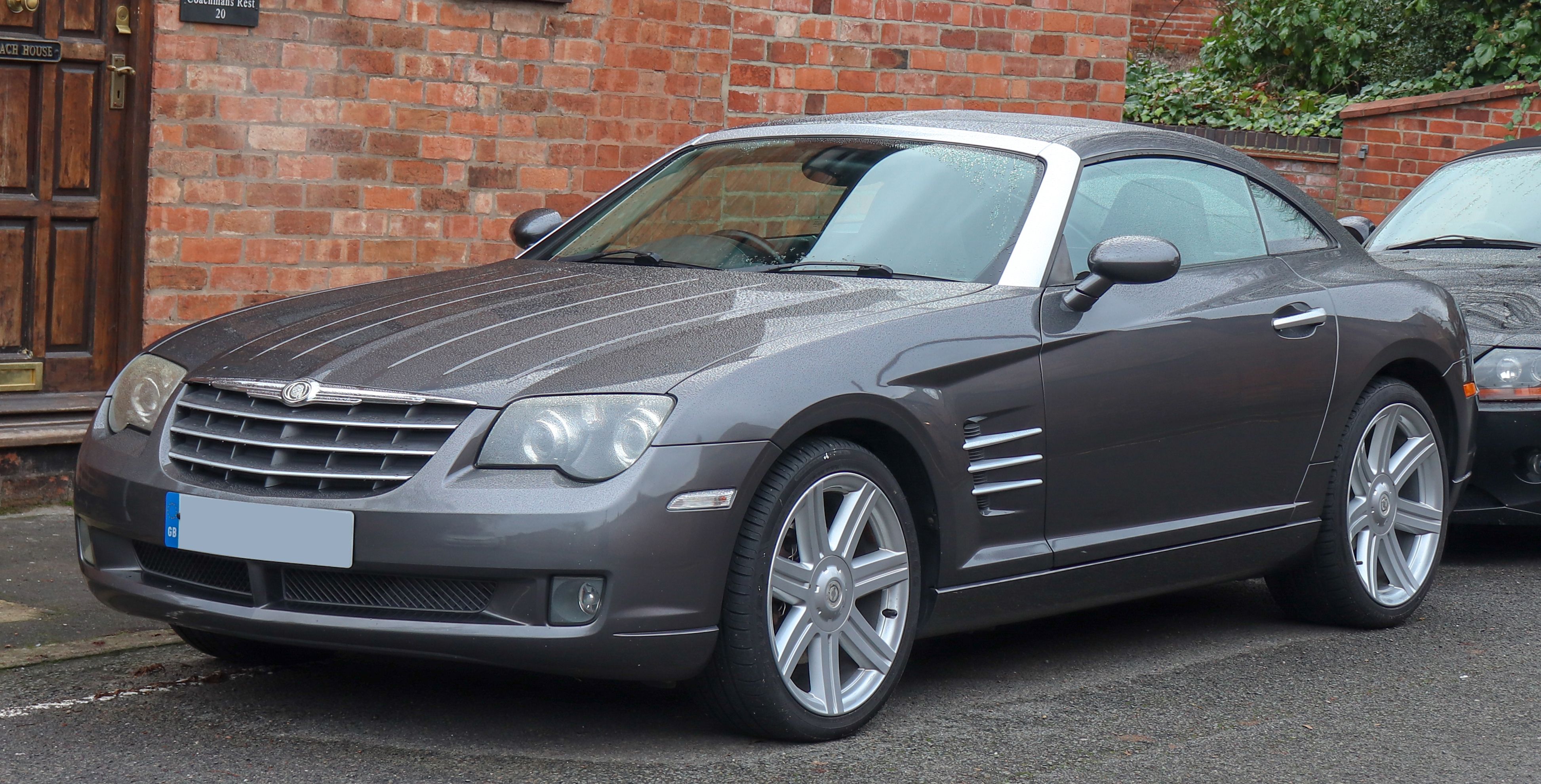 The 2004 Chrysler Crossfire parked on the street.