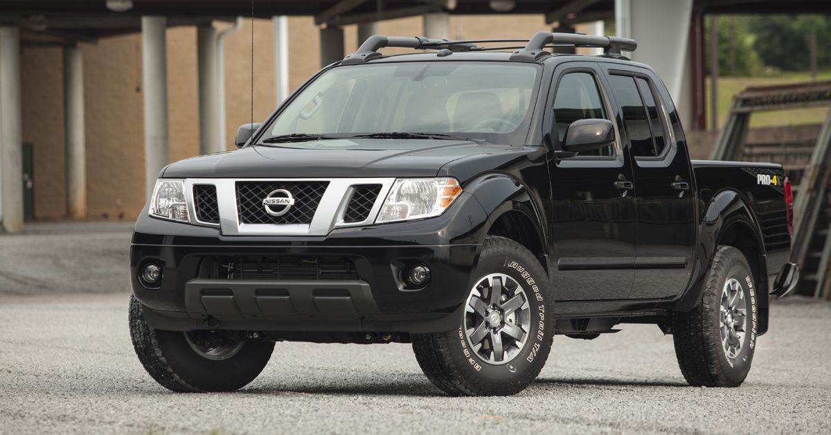 Black 2014 Nissan Frontier PRO-4X Parked On Driveway