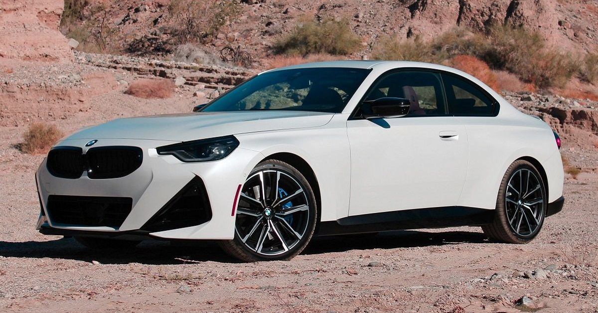 White 2022 BMW 230i in desert 