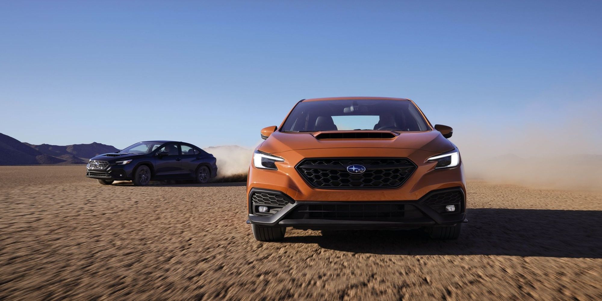 2022 Subaru WRX black and orange on the dirt