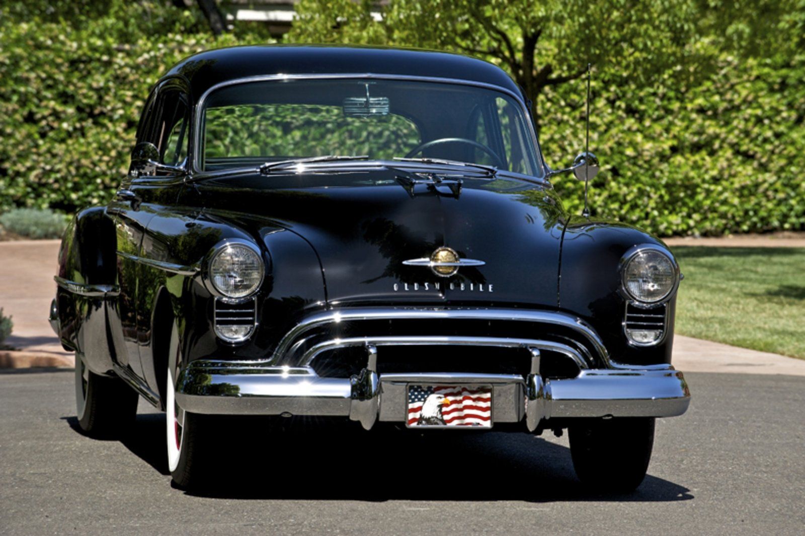 The Front View Of A Black 1949 Oldsmobile Rocket 88