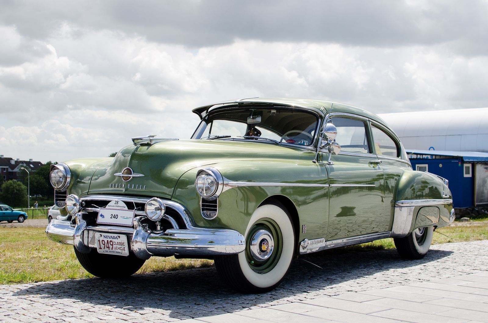 A Green 1949 Oldsmobile Rocket 88 On The Road