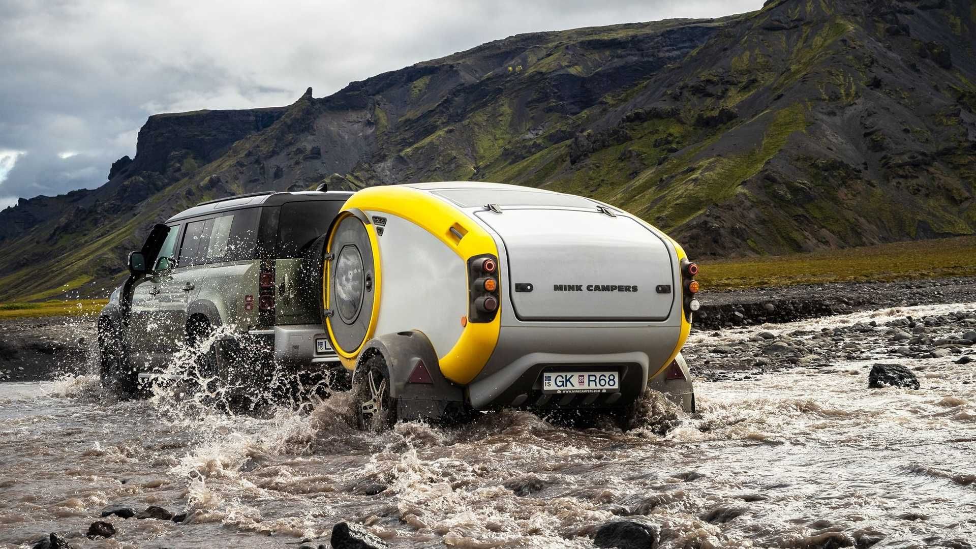 A MINK Camper Attached To An SUV