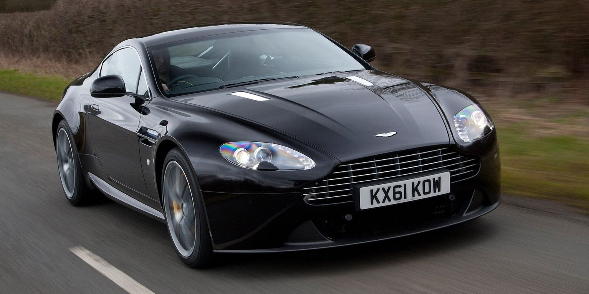 The front of a black V8 Vantage on the move