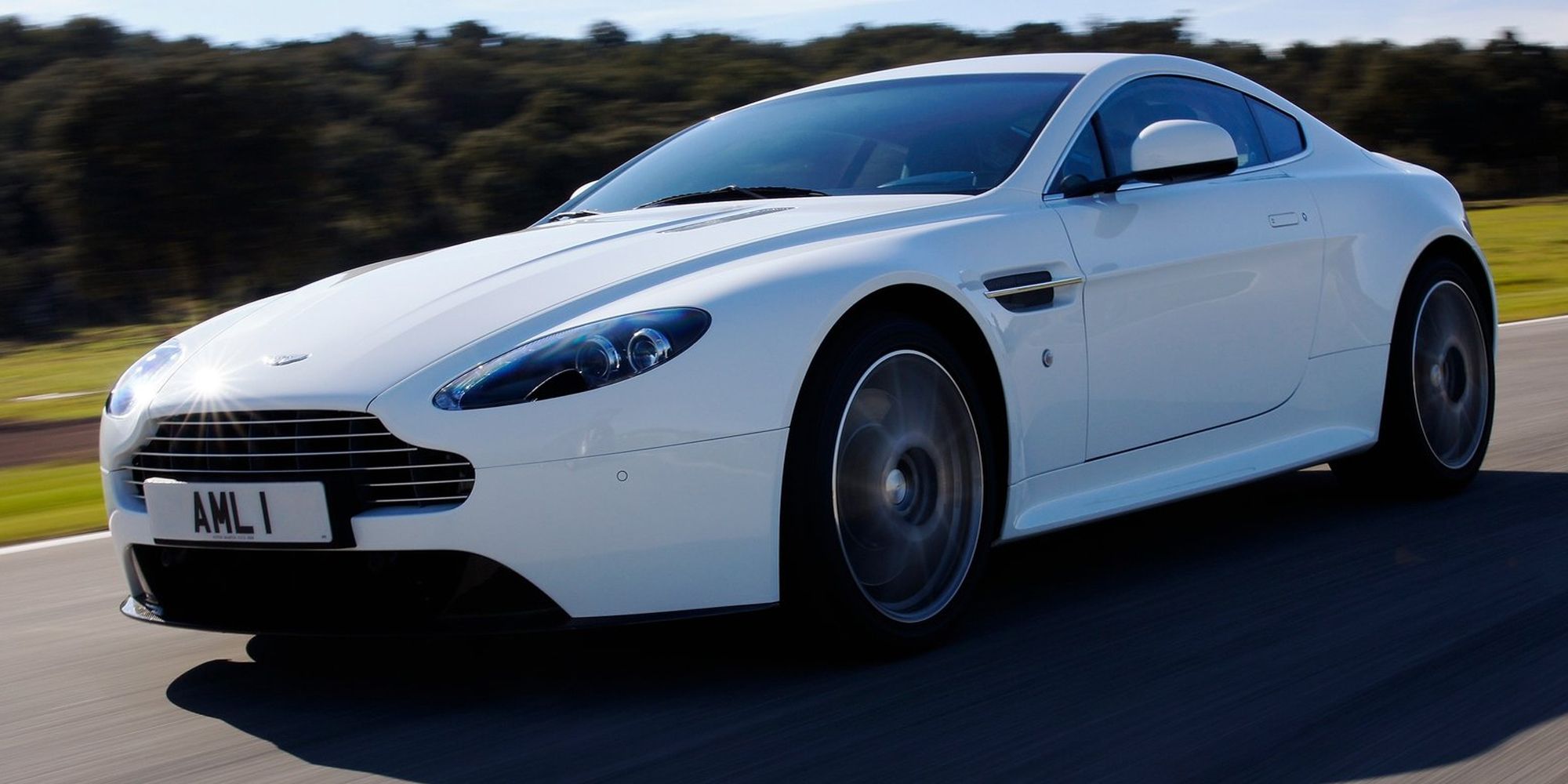 Front 3/4 view of a white V8 Vantage S on the move