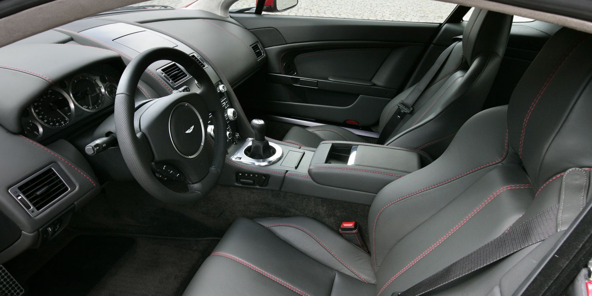 The interior of the V8 Vantage, black leather with red stitching