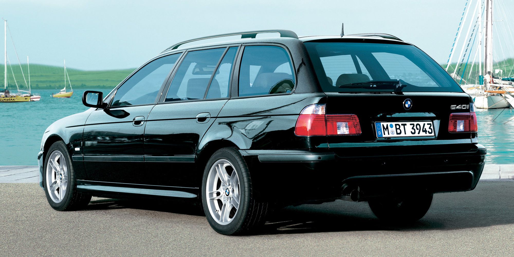 Rear 3/4 view of a black 540i Touring