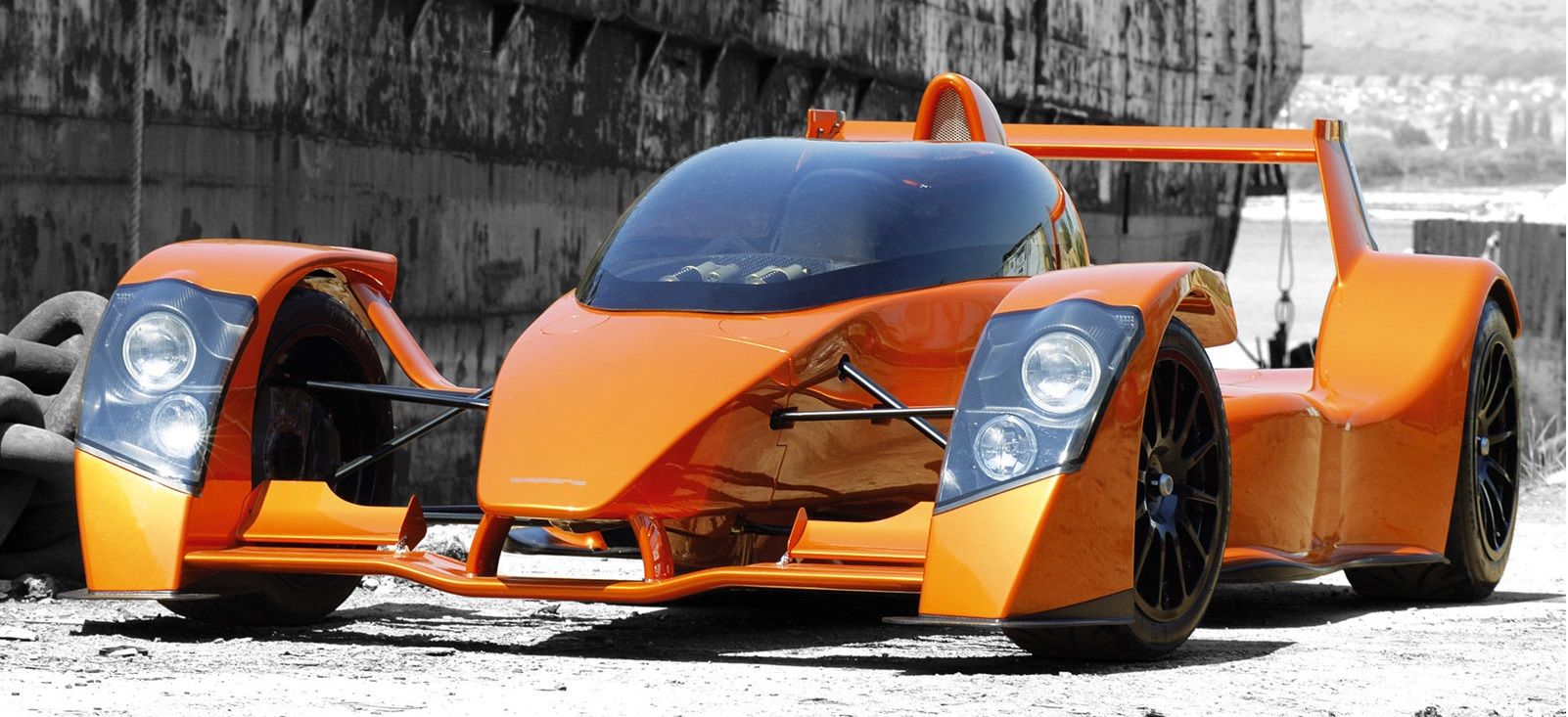 Orange Caparo T1 supercar parked