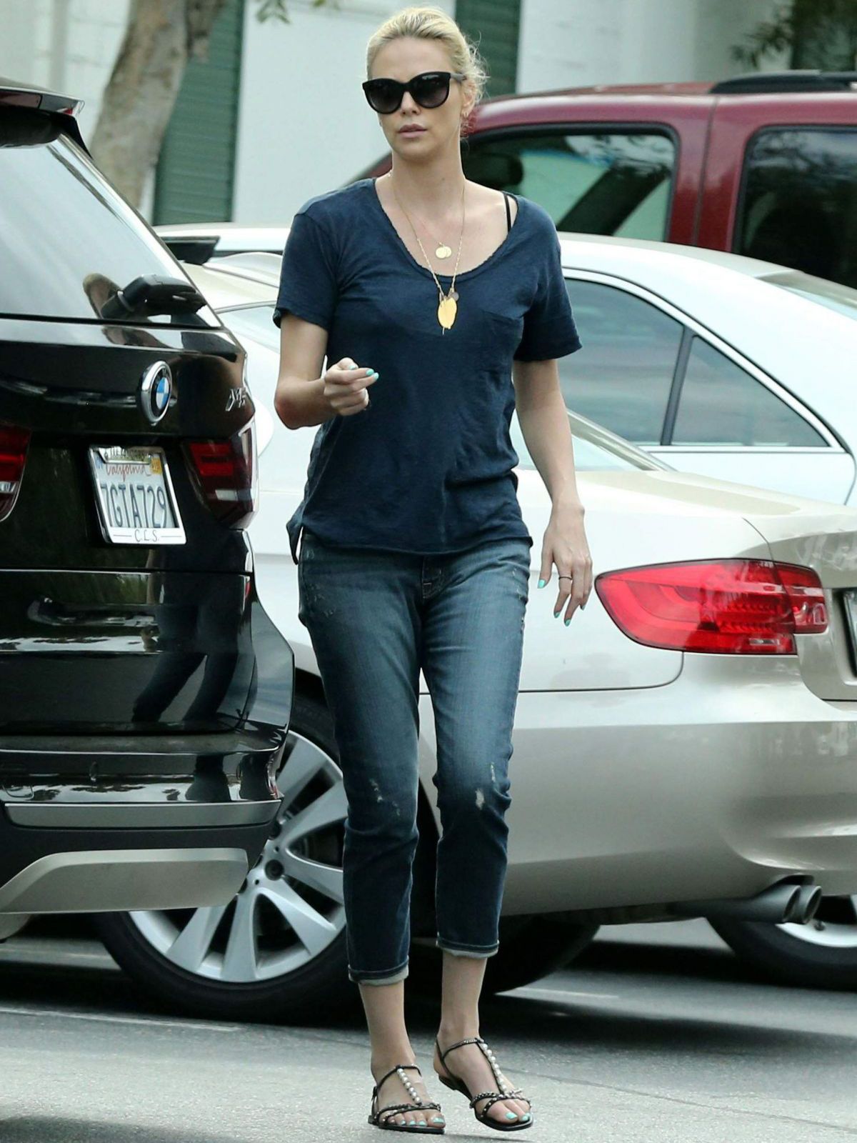 Charlize Theron With Her 2016 BMW X5 