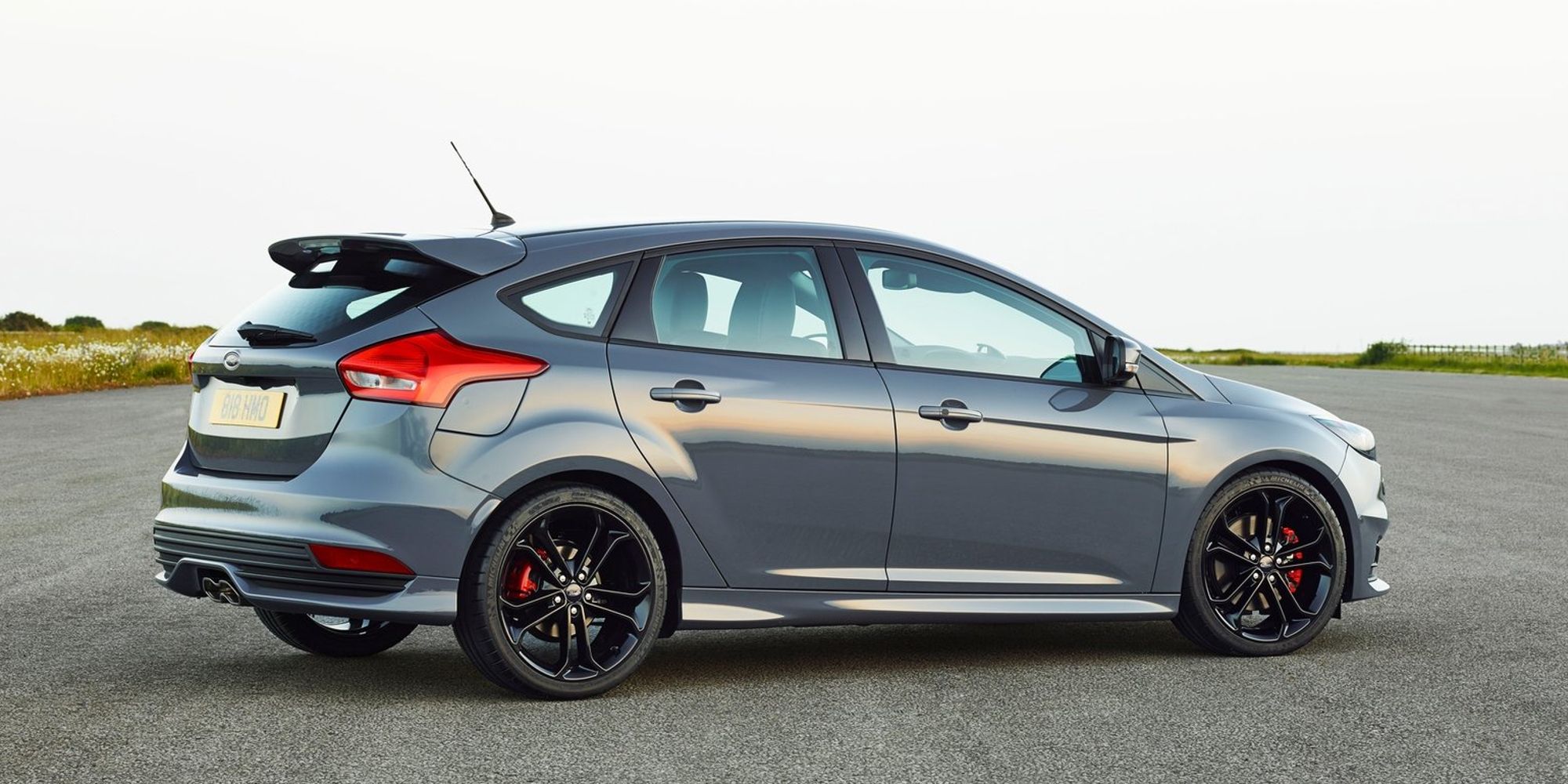 Rear 3/4 view of a gray Focus ST