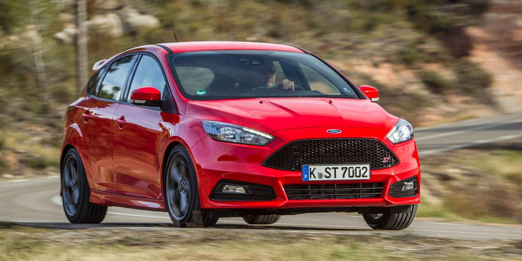 The front of a red Focus ST on the move