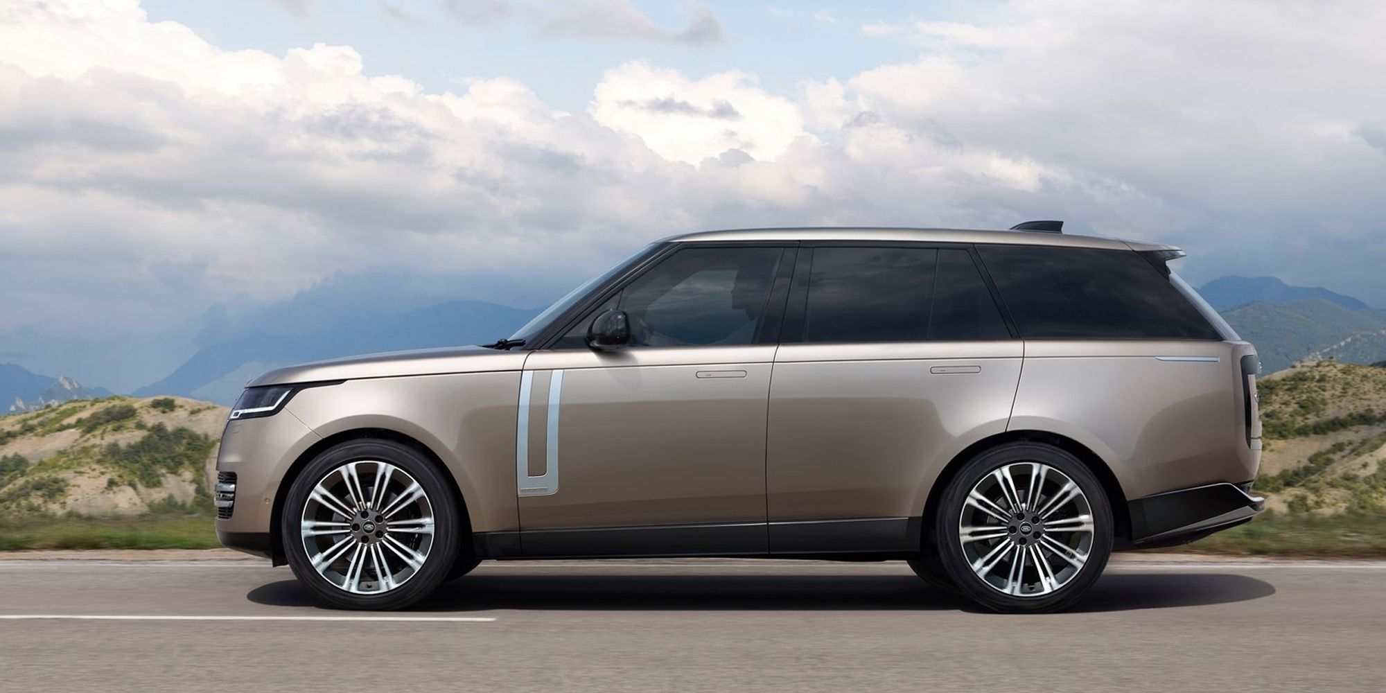 The side of a gold Range Rover