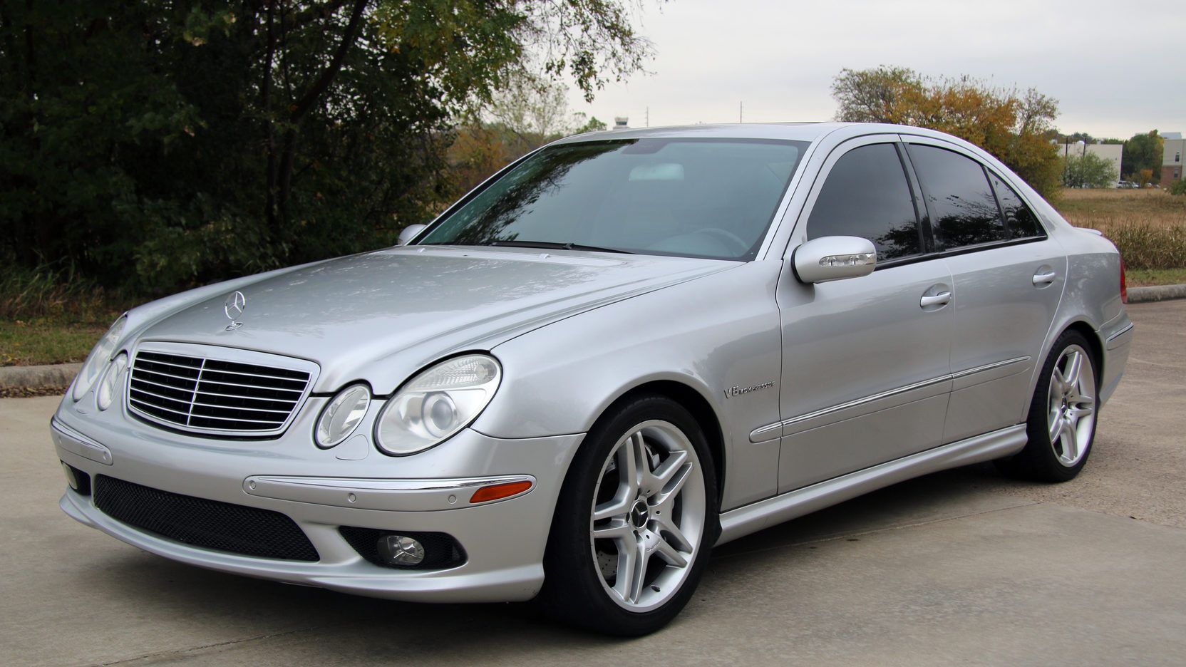 Silver Mercedes-Benz E55 AMG on the driveway