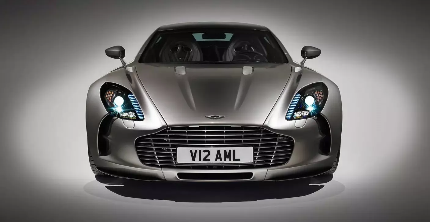 Aston Martin One-77, silver, front profile view, plain backdrop