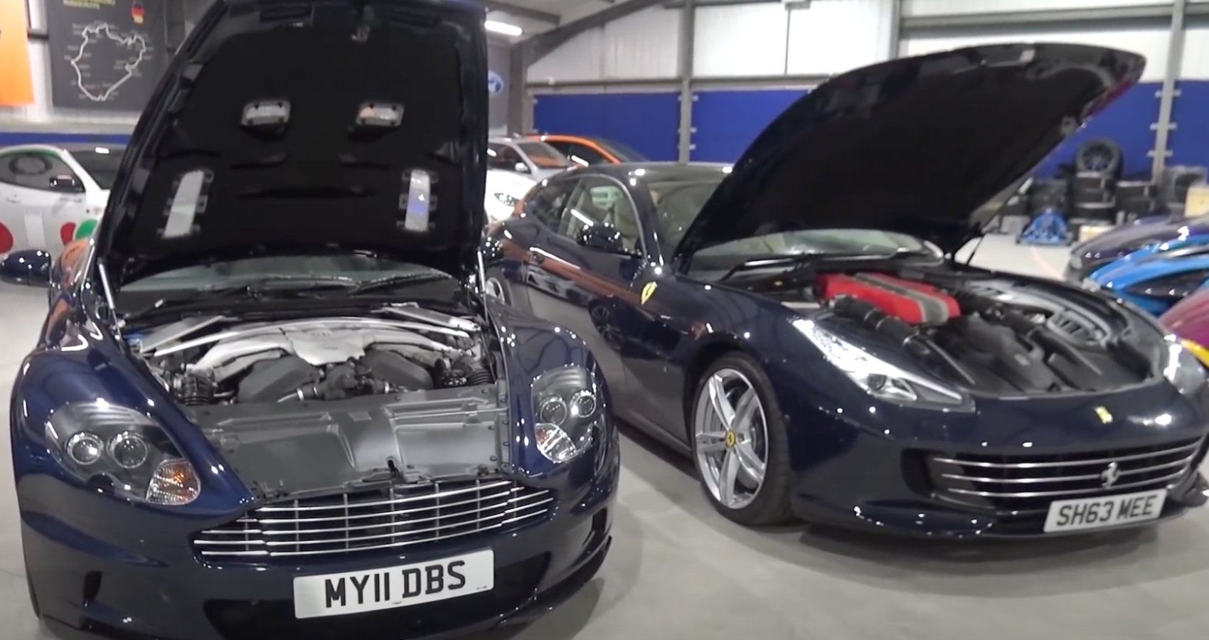 Ferrari Lusso and Aston Martin with their hoods popped