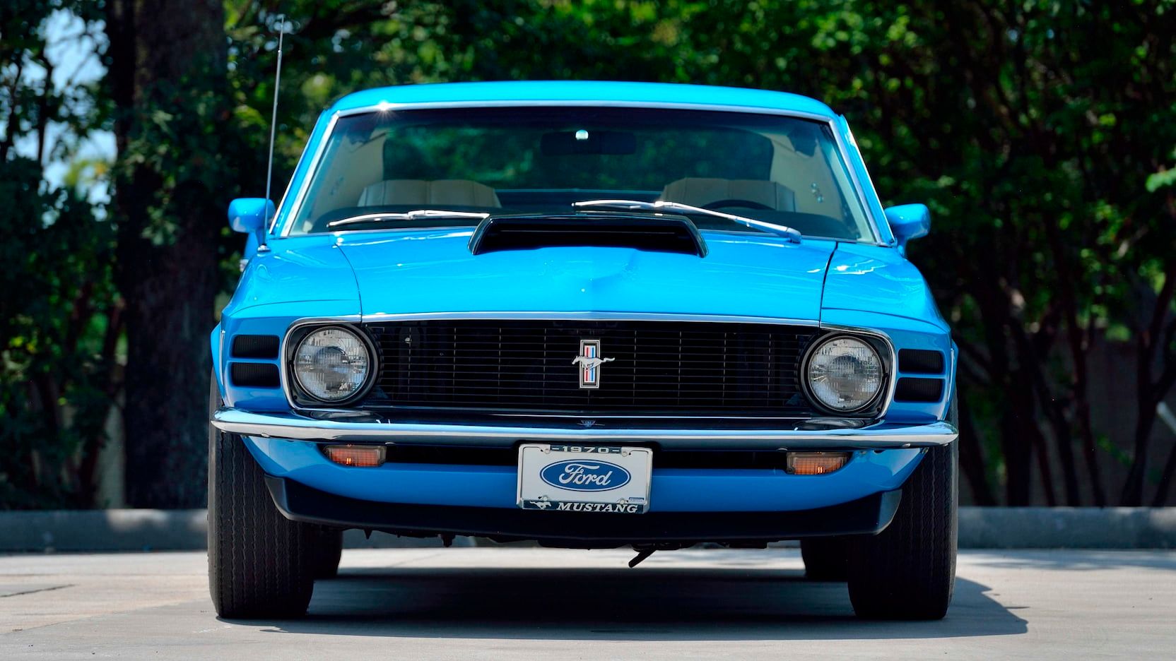 The Front View Of A Blue 1970 Ford Mustang Boss 429