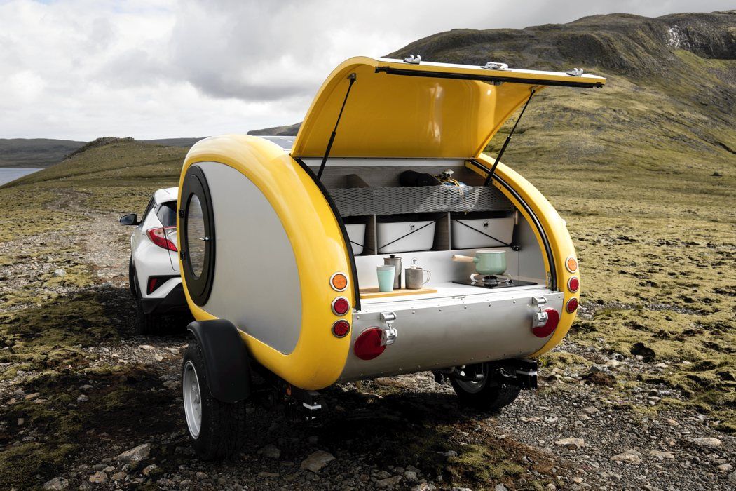 The Rear Of A Yellow MINK Camper