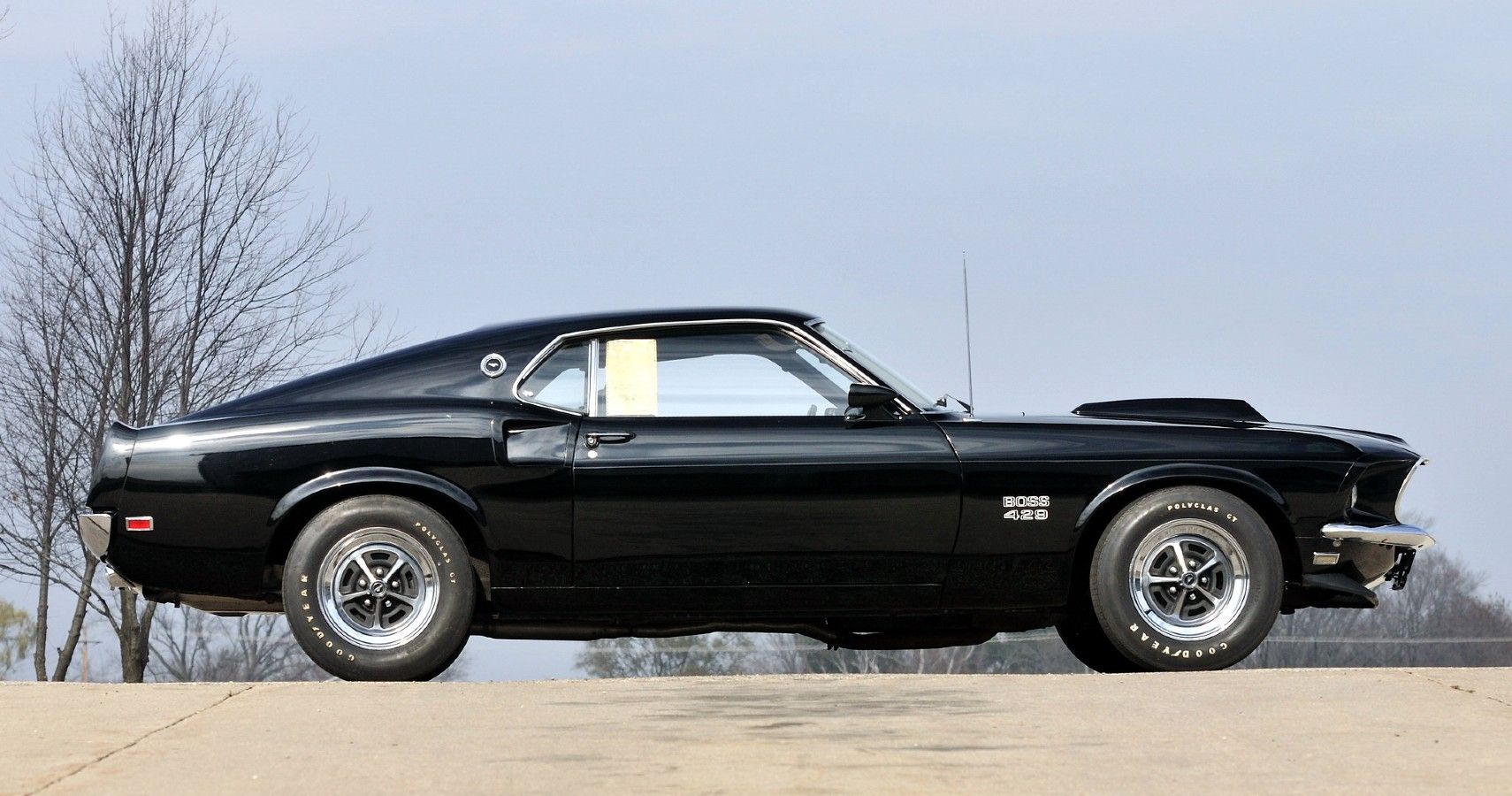 The Side View Of A Black 1970 Ford Mustang Boss 429