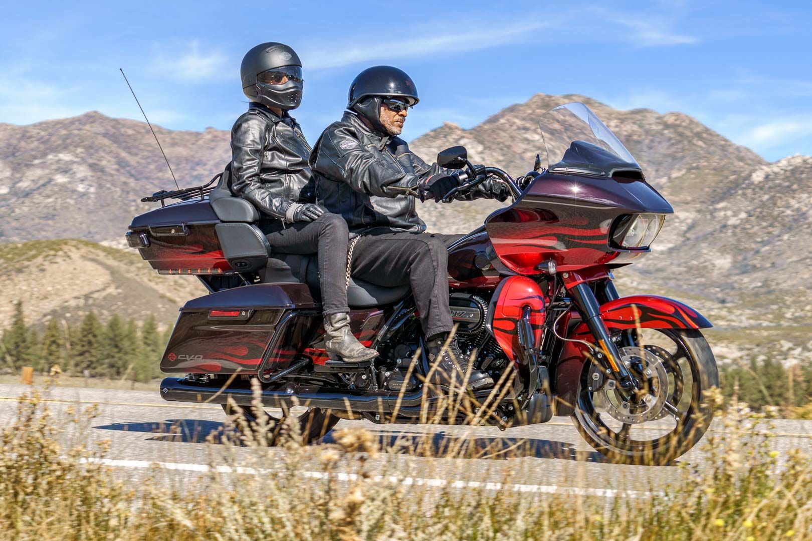 Two People Riding On A 2022 Harley-Davidson CVO Road Glide Limited