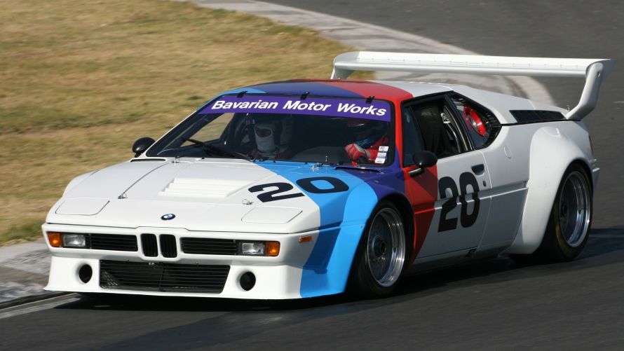 The 1980 BMW M1 racing on the track.