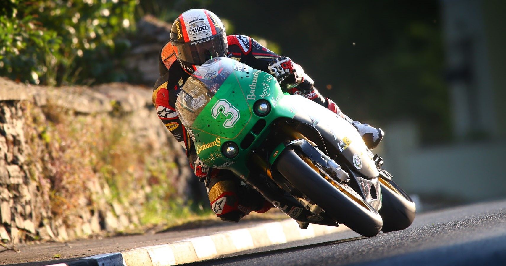 A Supertwin motorcycle cornering on the Isle Of Man TT