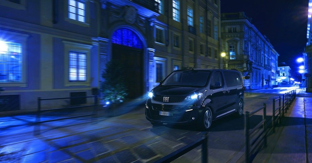 Fiat E-Ulysse night, front quarter view, driving in street