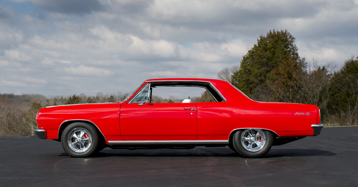 Red 1965 chevy chevelle ss - side view