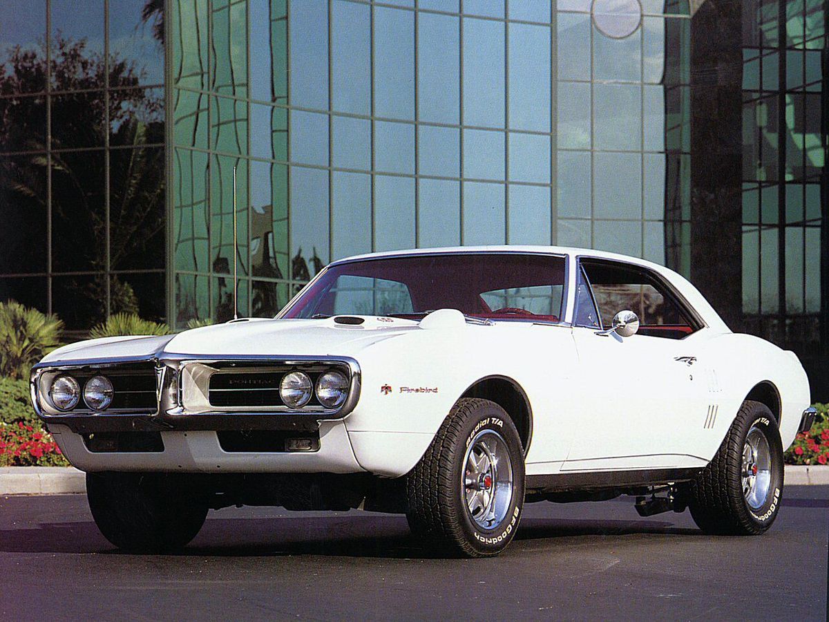 The 1967 Pontiac Firebird 400 Sport Coupe parked outside.