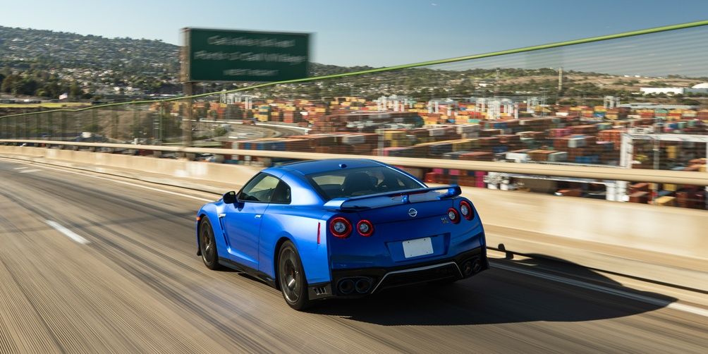 Nissan GTR 2022 blue on the highway over the city