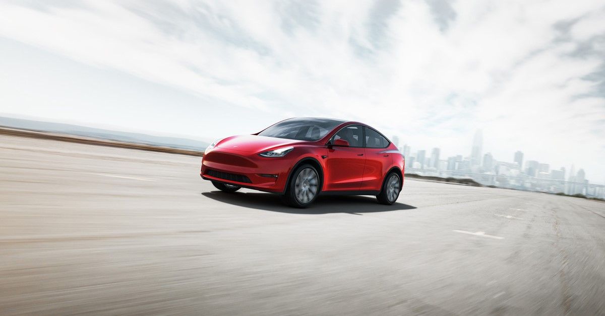 Tesla Model Y front third quarter accelerating view