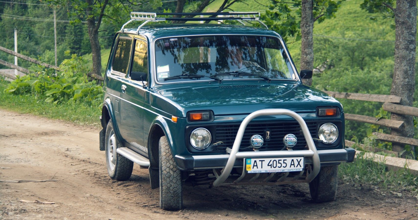 Lada Niva in British green front view with front bull bar