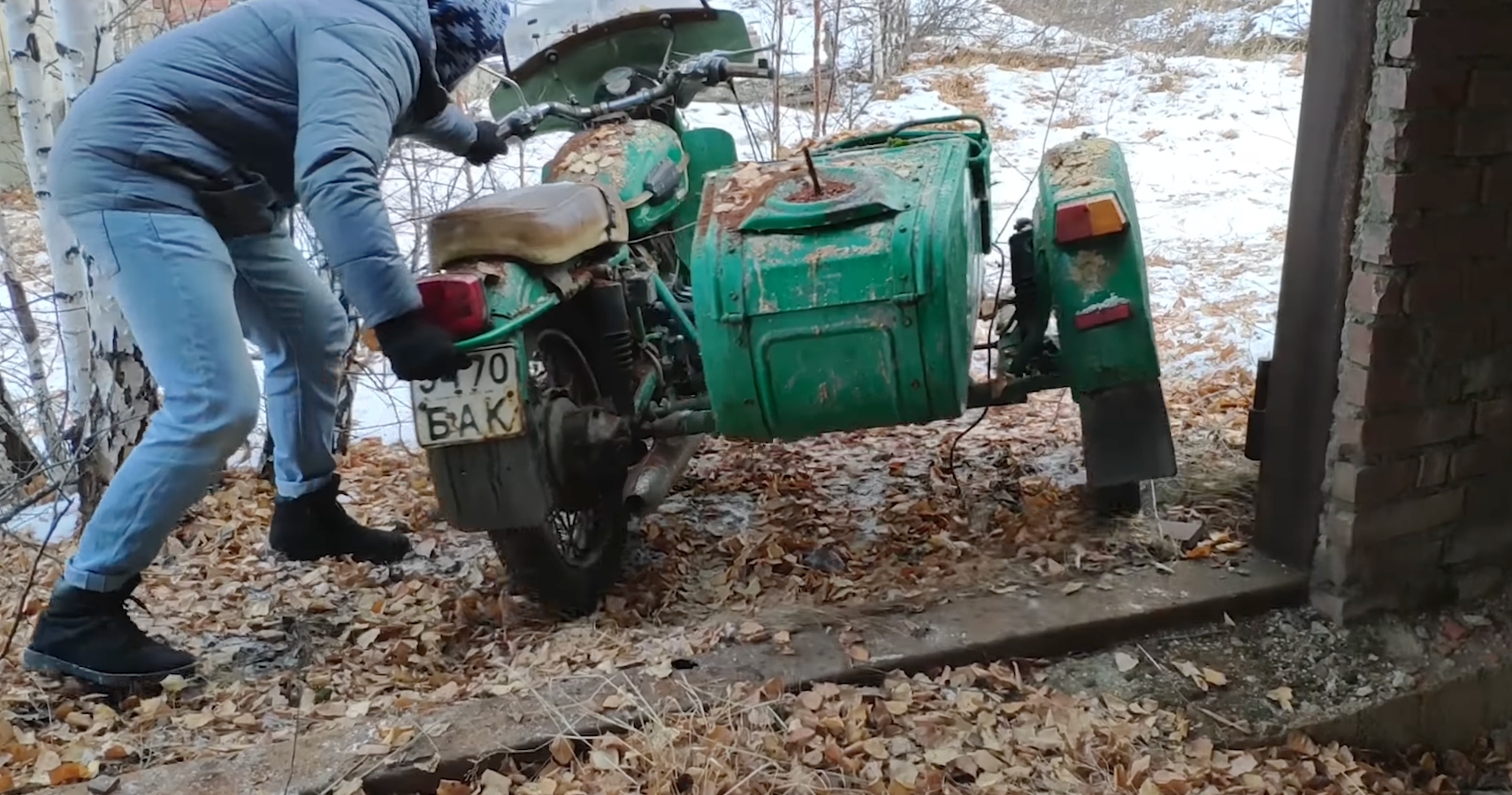 Abandoned Ural Motorcycle carted out