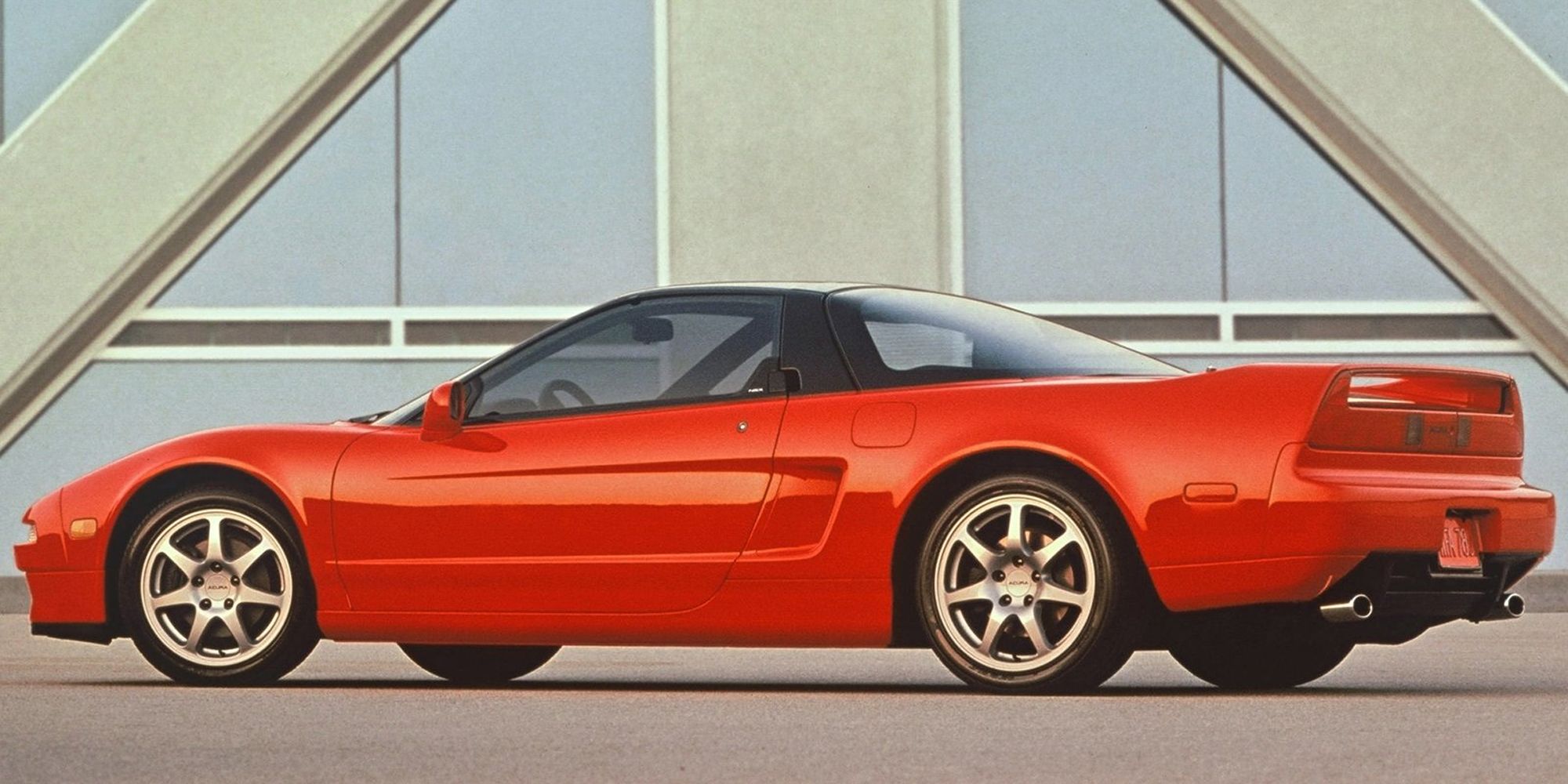 Rear 3/4 view of a red NSX