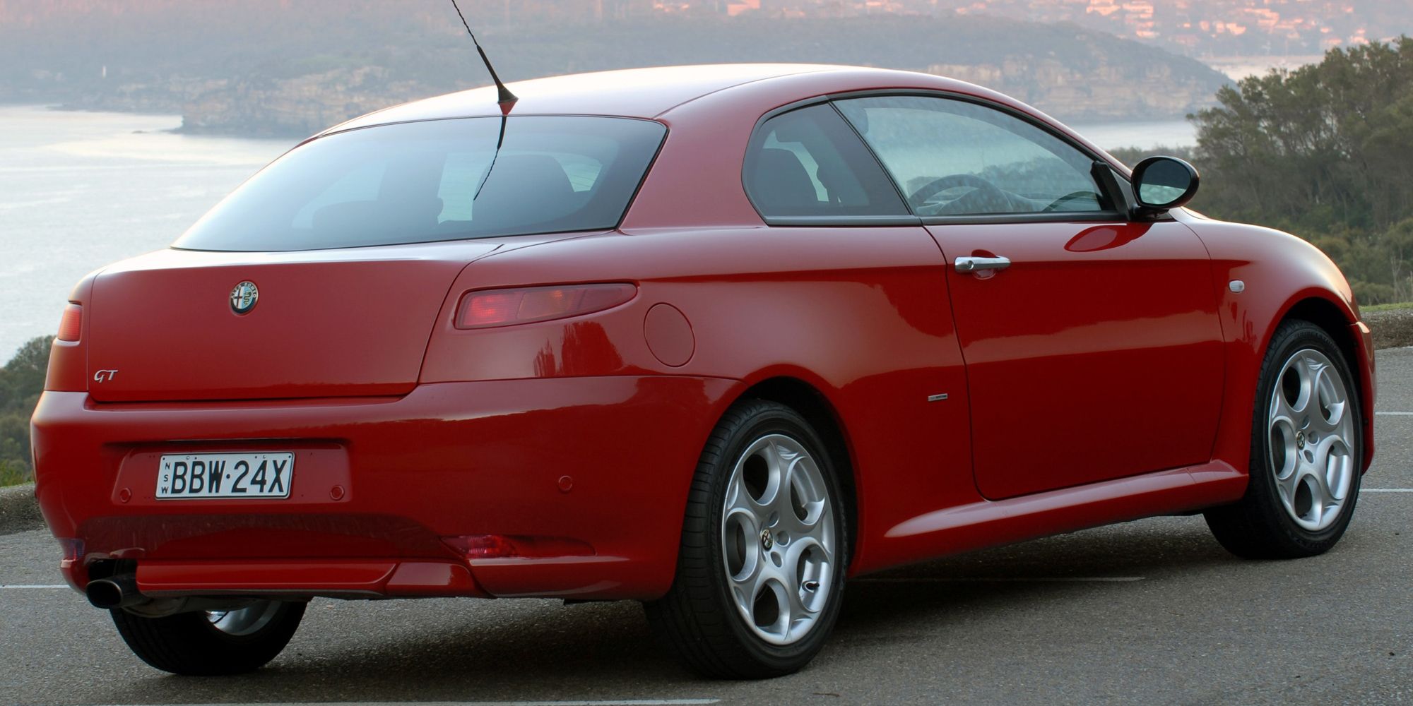 Rear 3/4 view of a red Alfa Romeo GT