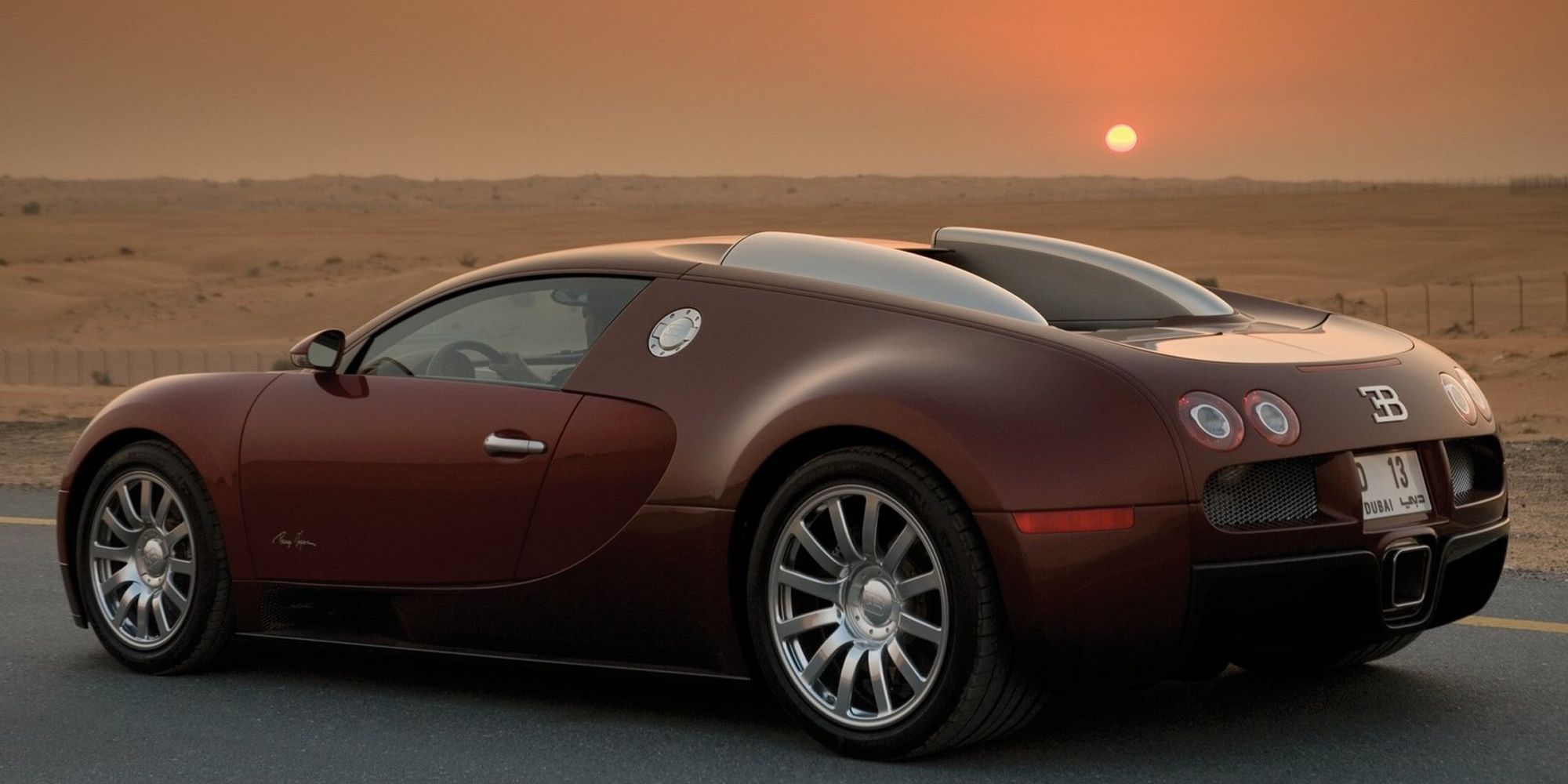 Rear 3/4 view of a red Veyron