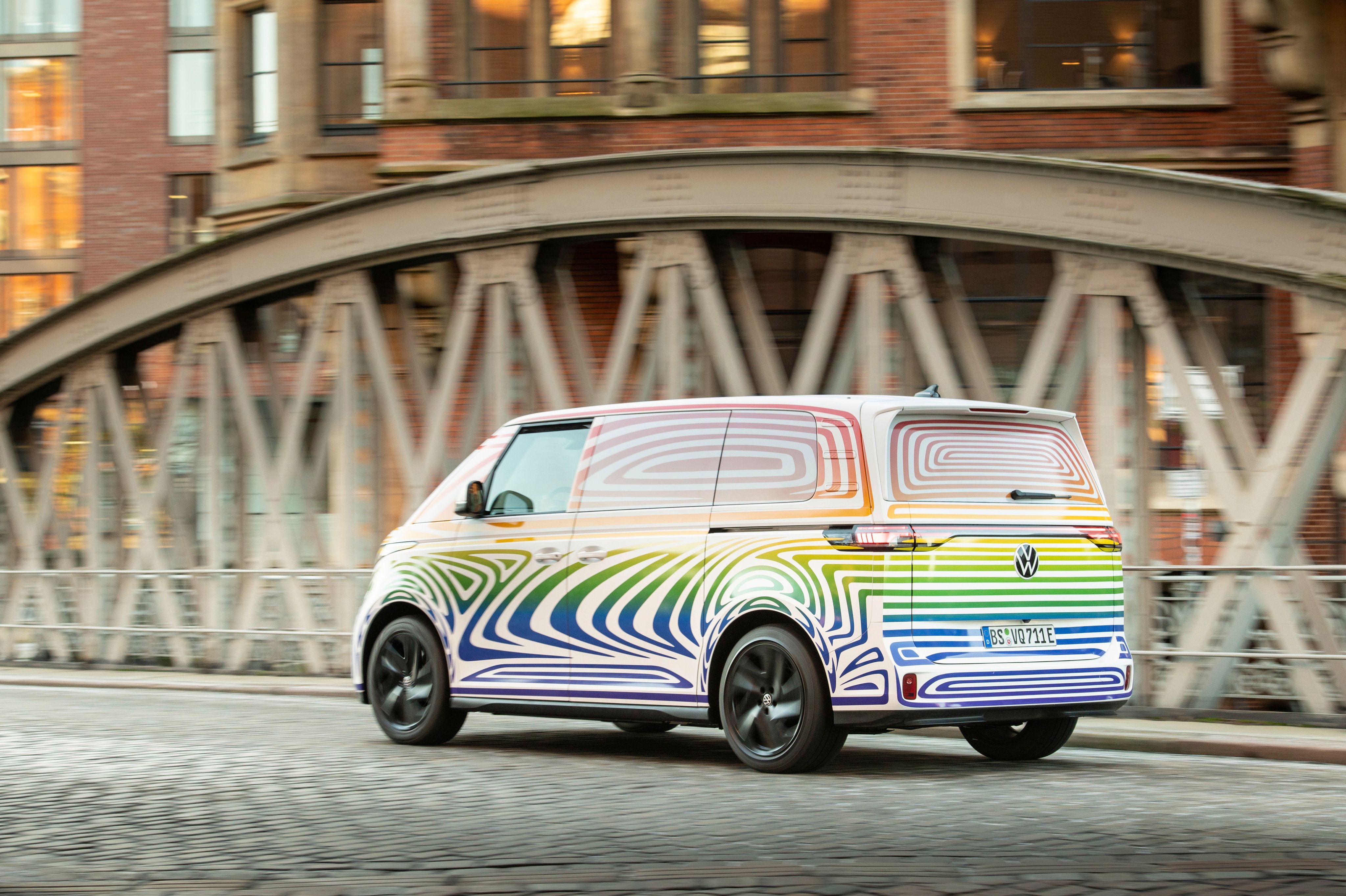Volkswagen ID. Buzz, multicolor, rear-quarter view, on road