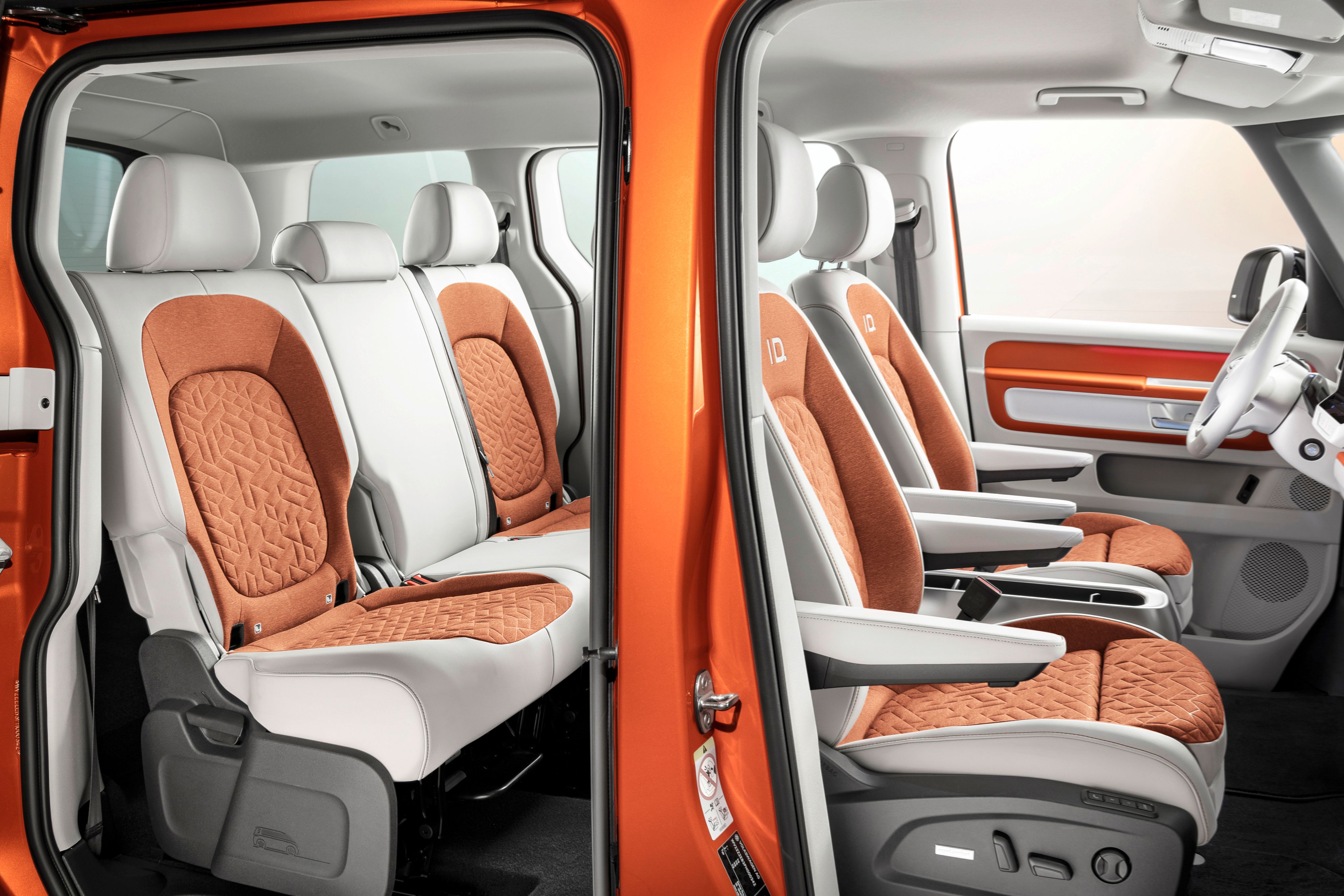 Volkswagen ID. Buzz interior, side profile shot, two-tone color orange/white