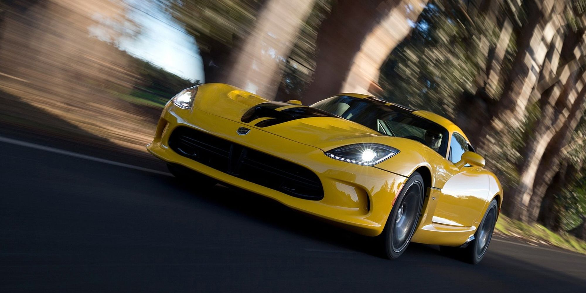 The front of a yellow Viper in motion