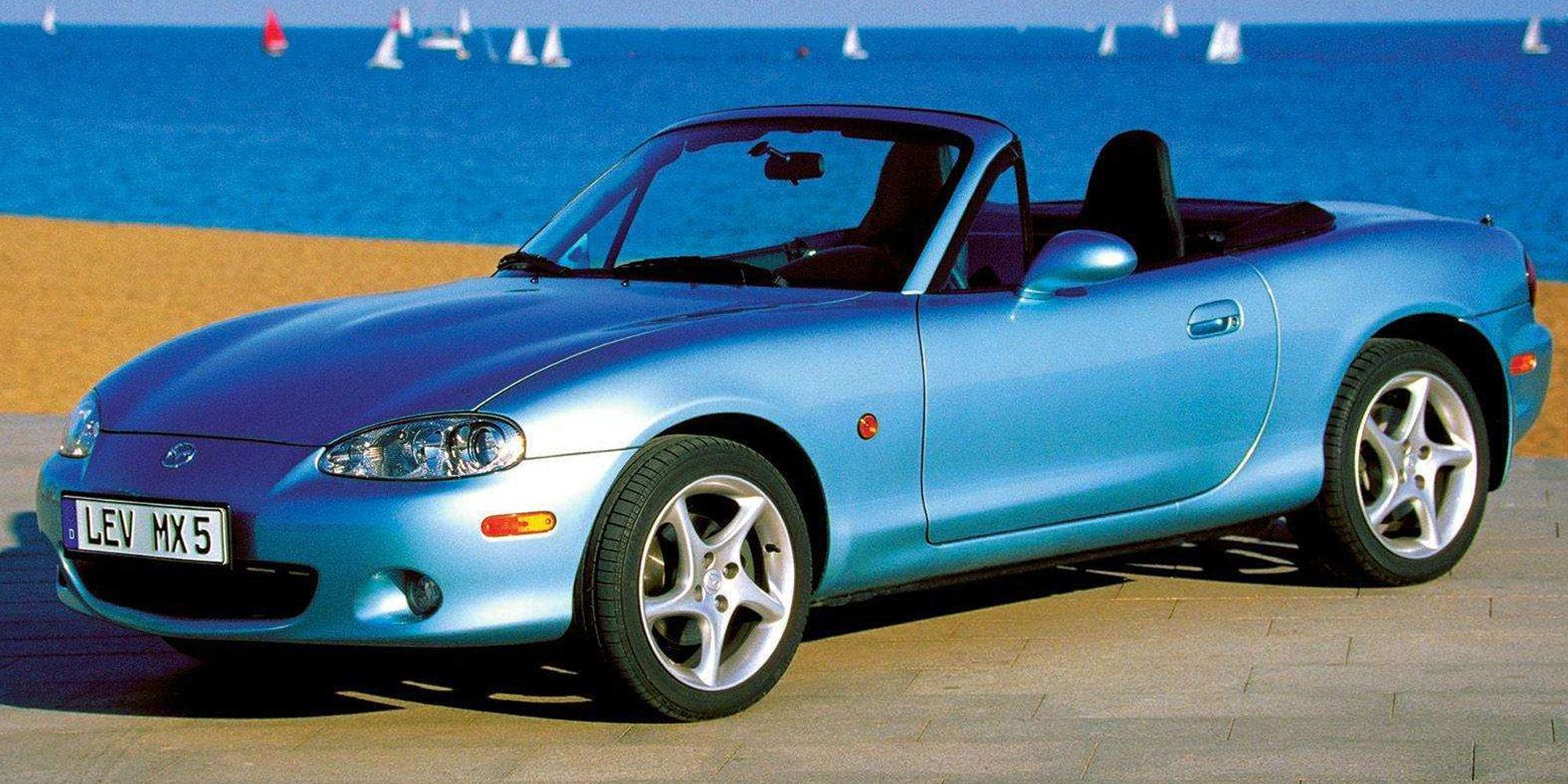 Front 3/4 view of a bright blue NB MX-5