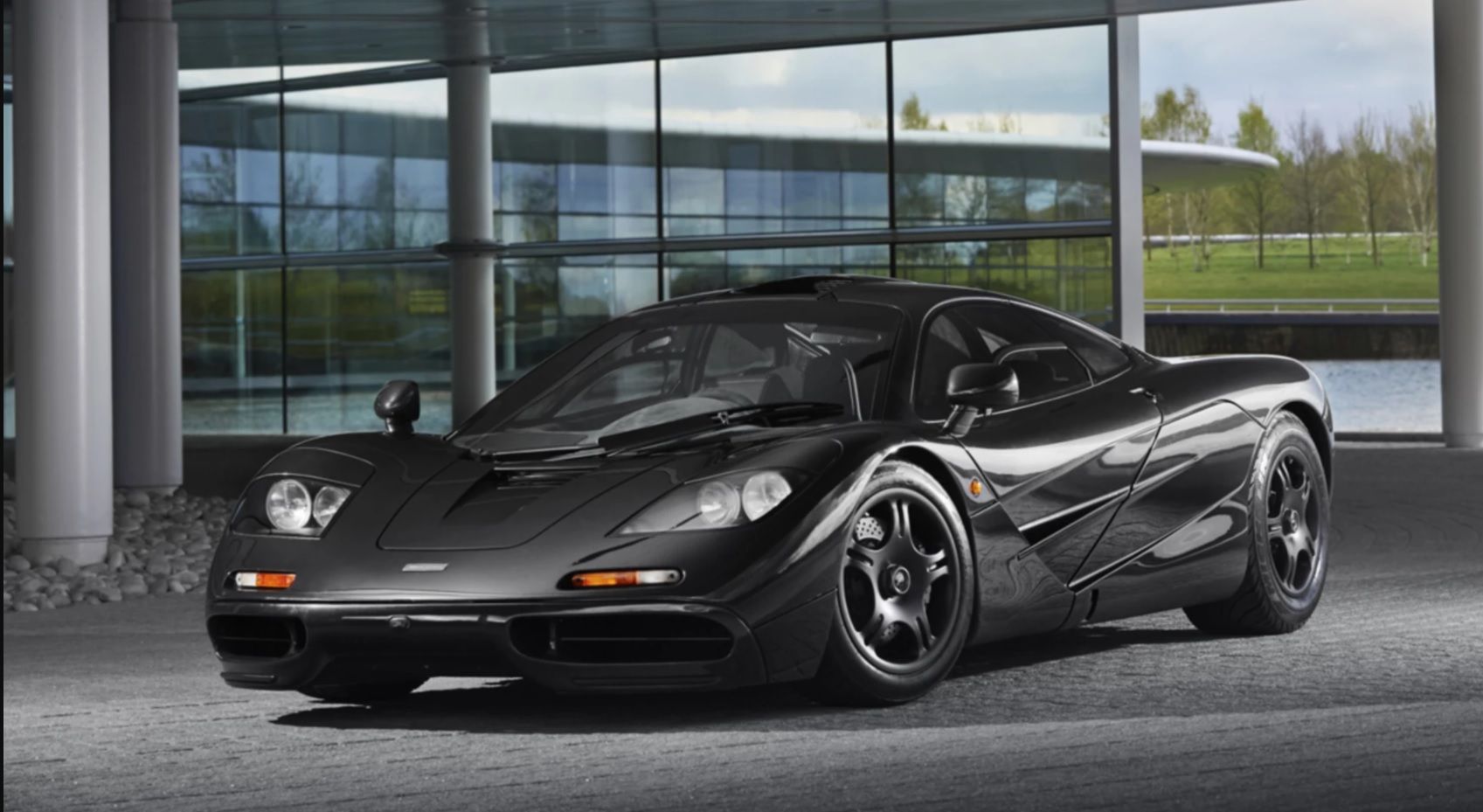 The black 1997 McLaren F1 parked outside. 