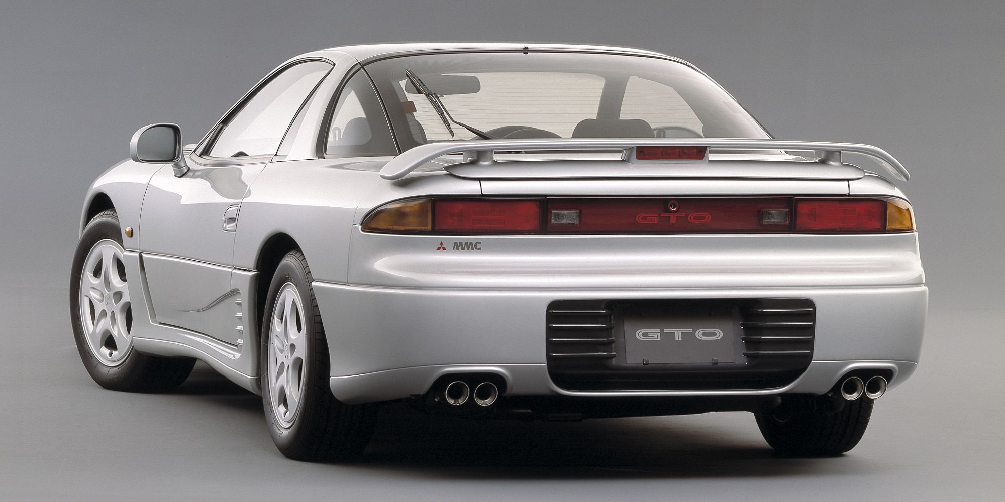 The rear of a silver GTO, studio shot