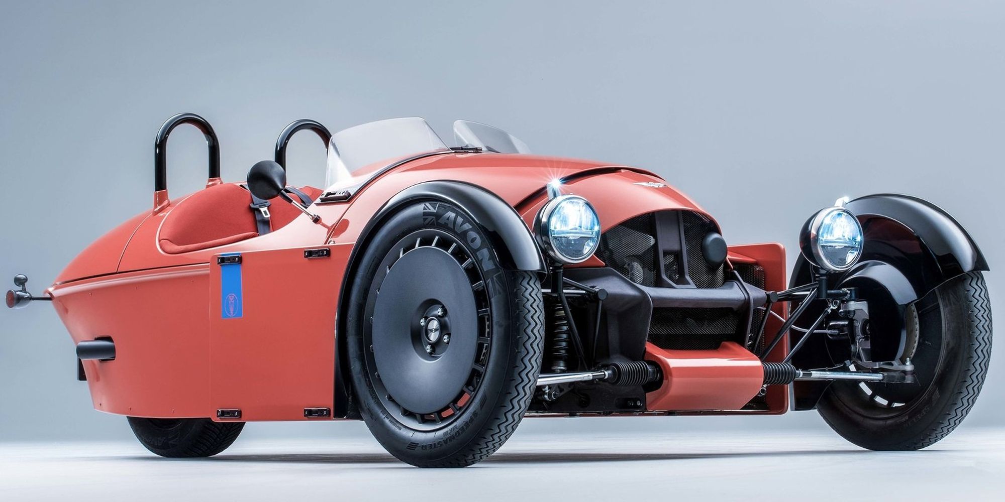 The front of a red Super 3, studio shot