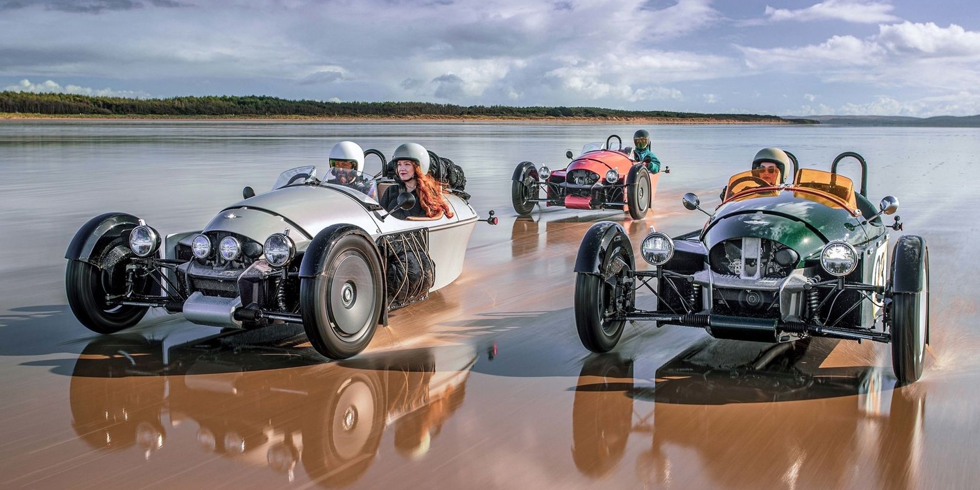 A trio of Super 3s speeding down wet sand