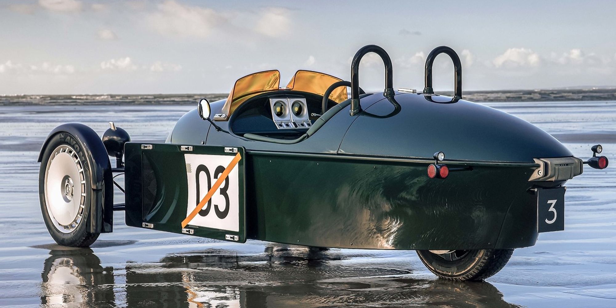 Rear 3/4 view of a green Super 3