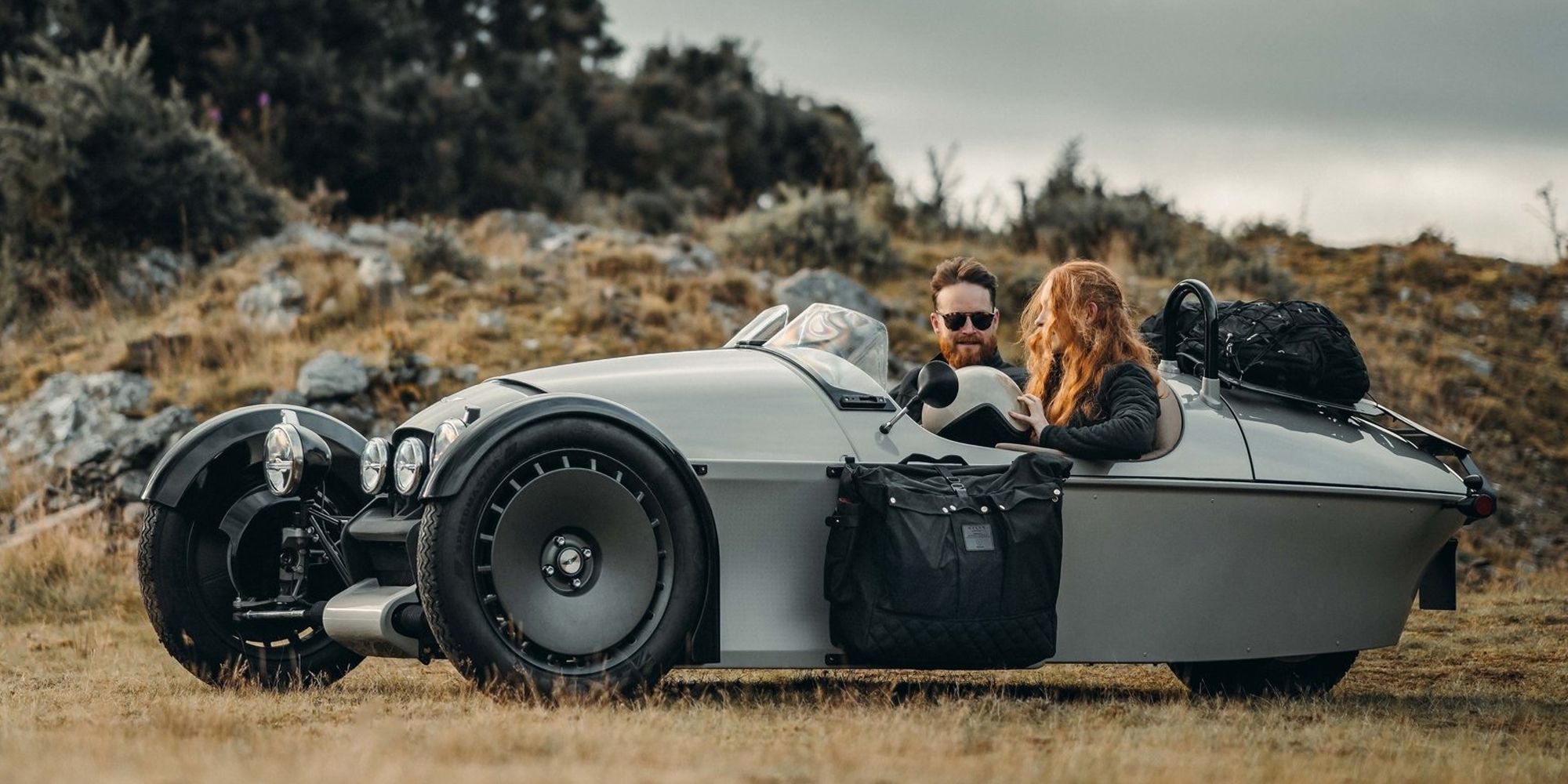 Front 3/4 view of a gray Super 3 in a field