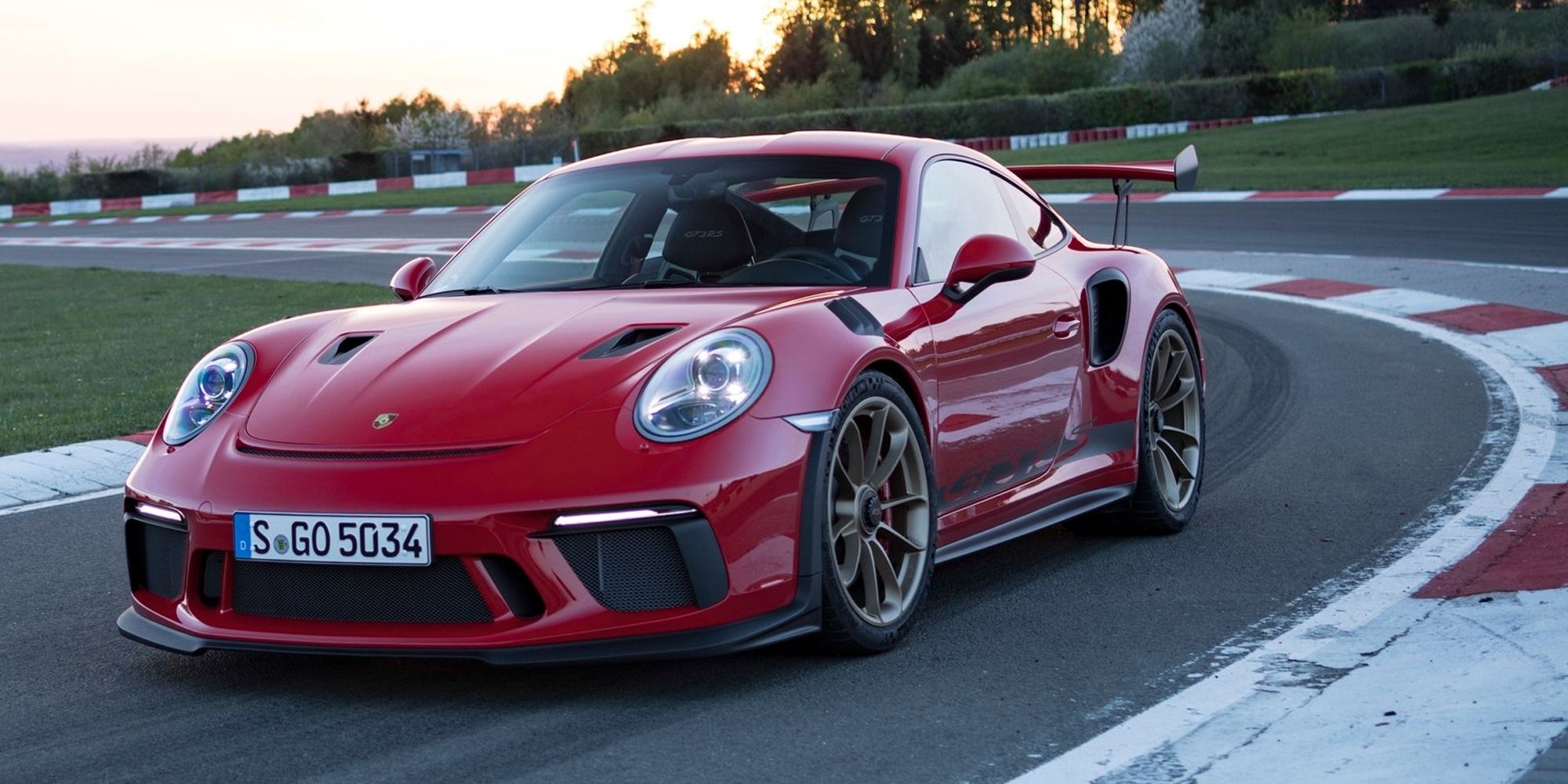 Front 3/4 view of a red GT3 RS on the race track