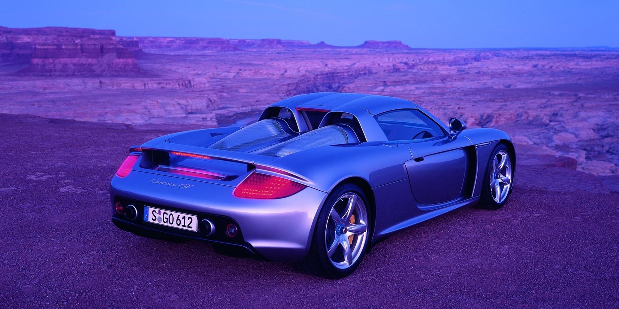 Rear 3/4 view of the Carrera GT overlooking a canyon